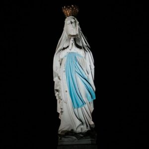 virgin mary statue on black surface